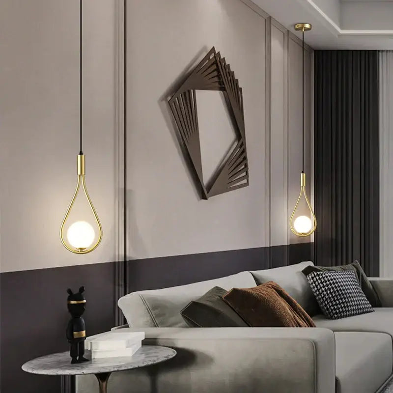Modern gold teardrop glass ball pendant lights with sleek design hang from ceiling ideal for kitchen decorbites decor