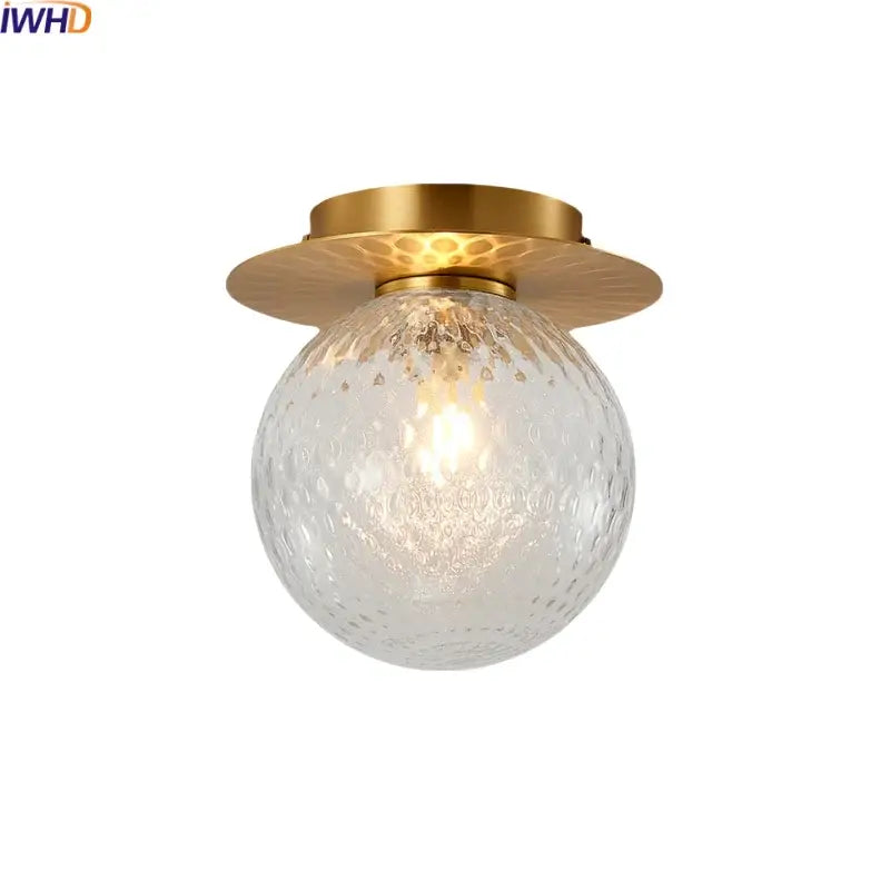 Modern gold textured glass ceiling lamp with a clear textured globe by decorbites iron for living room lighting
