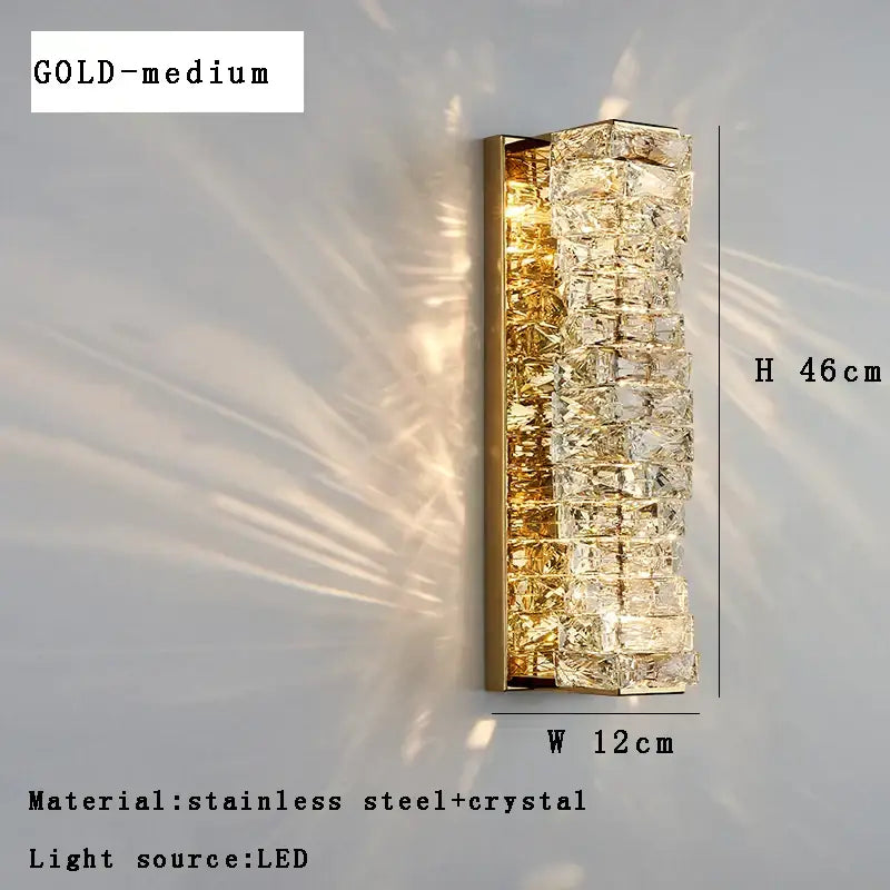 Modern gold textured glass wall sconce lamps with faceted crystal segments in stainless steel illuminated by led light