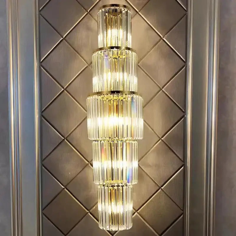 Modern gold tiered crystal nordic wall lamp with illuminated vertical glass rods and gold-toned metal accents for living room decorbites crystal nordic style
