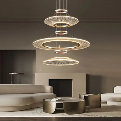 Modern gold tiered mesh pendant chandelier with concentric circular rings and warm led lighting for living room use
