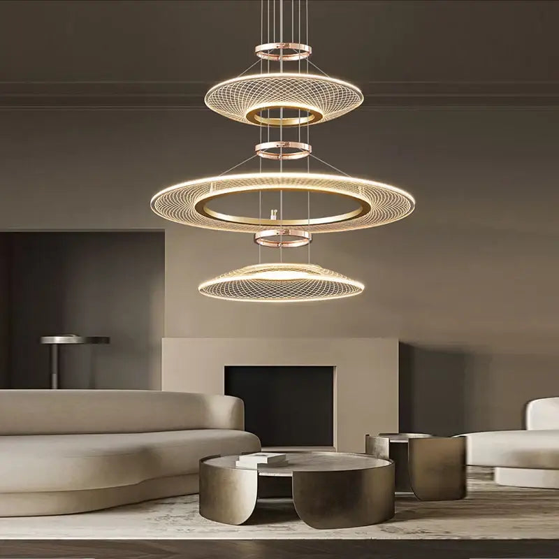 Modern gold tiered mesh pendant chandelier with concentric circular rings and warm led lighting for living room use