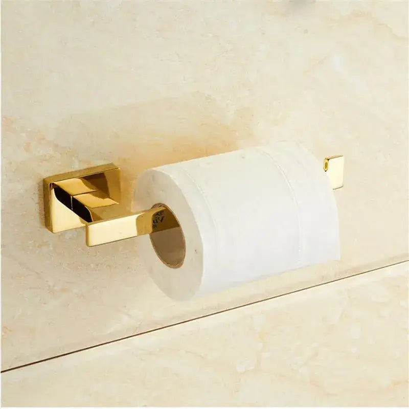 Modern gold towel ranger accessory rack featuring a sleek gold-toned metal toilet paper holder for bathroom decorbites