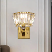 Modern gold trapezoid crystal blocks wall sconce with fan-shaped clear faceted crystal panels for living room lighting