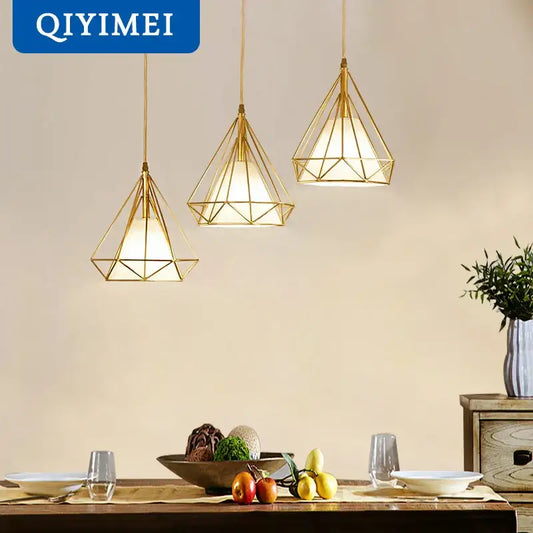 Modern gold triangle pendant lights featuring geometric faceted design for dining room decorbites gold triangle fixture