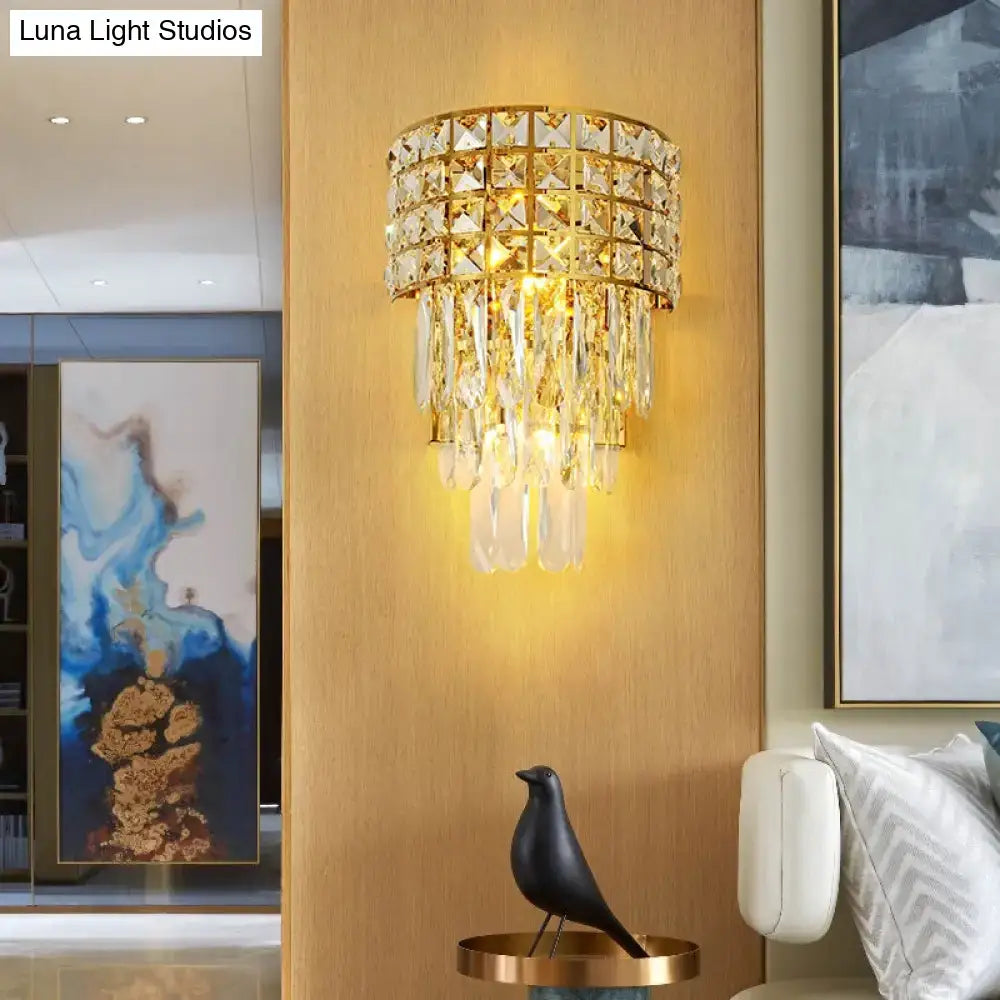Modern gold triangular crystal wall lamp with tiered faceted glass and teardrop crystals for 110v-120v use