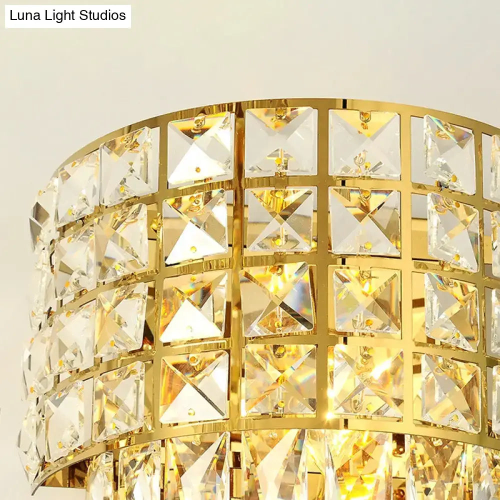 Modern gold triangular crystal wall lamp with faceted clear crystals in polished brass frame for 110v-120v lighting