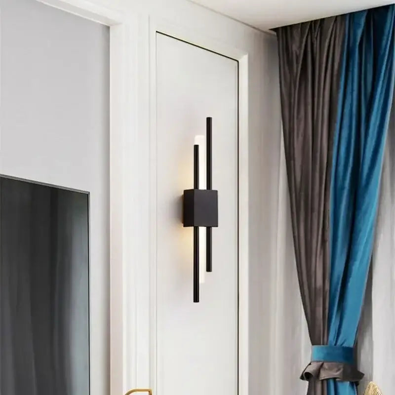 Black modern wall sconce with sleek vertical bars and square base for decorbites gold tube wall lighting decor