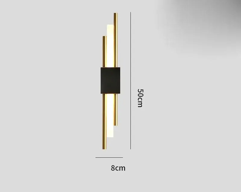 Modern gold tube wall sconce with sleek black accent and three vertical illuminated bars for bedroom decorbites gold tube lighting