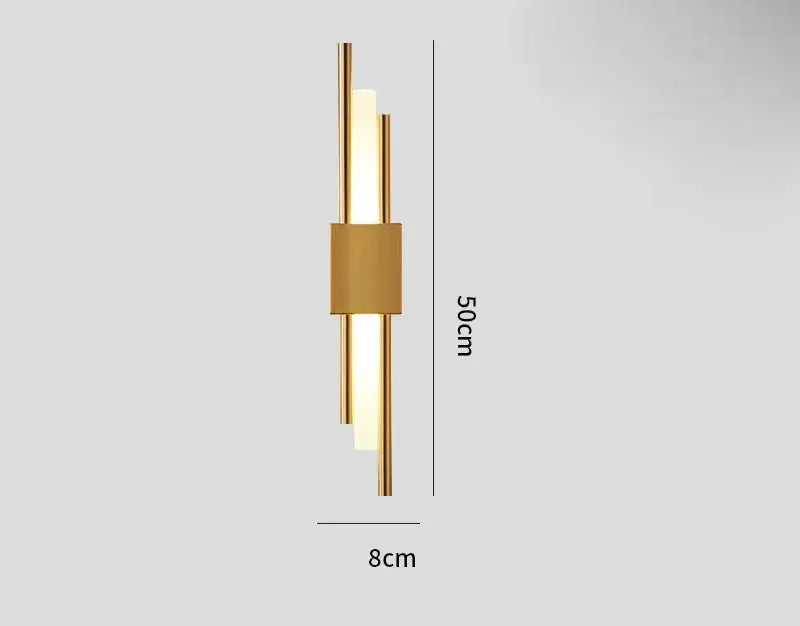 Modern gold tube wall sconce with three vertical cylindrical light tubes and fabric diffuser for bedroom decorbites gold tube