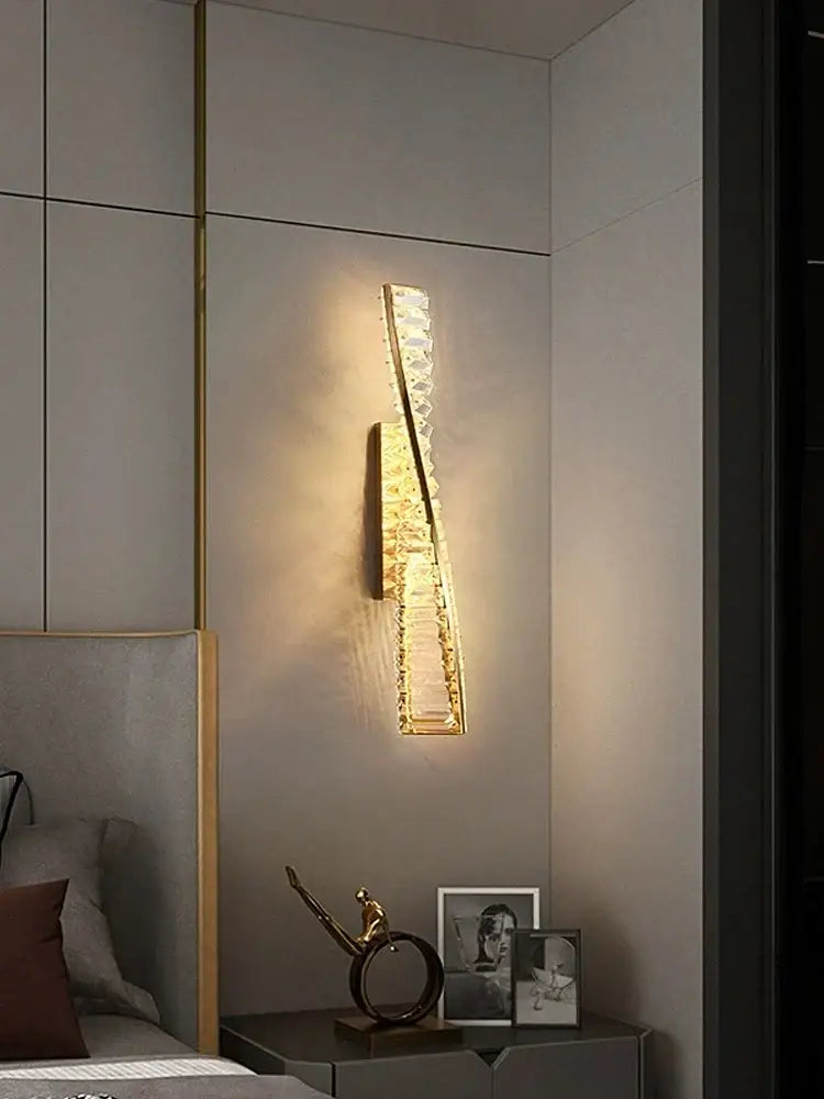 Modern gold twisted crystal wall sconce with sleek curved design and decorbites crystal wall accents for bedroom light