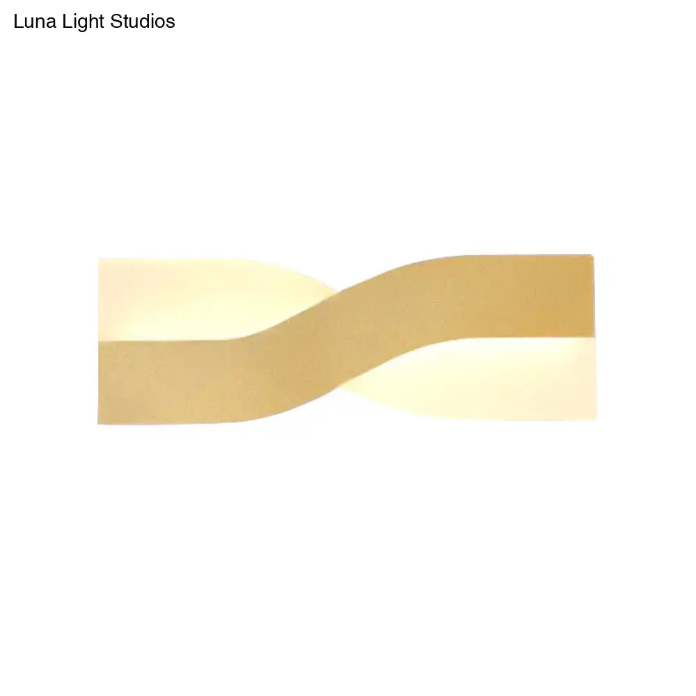 Modern gold-toned twisted wall lamp with sleek design and fixture width 8in for 110v-120v 220v-240v use
