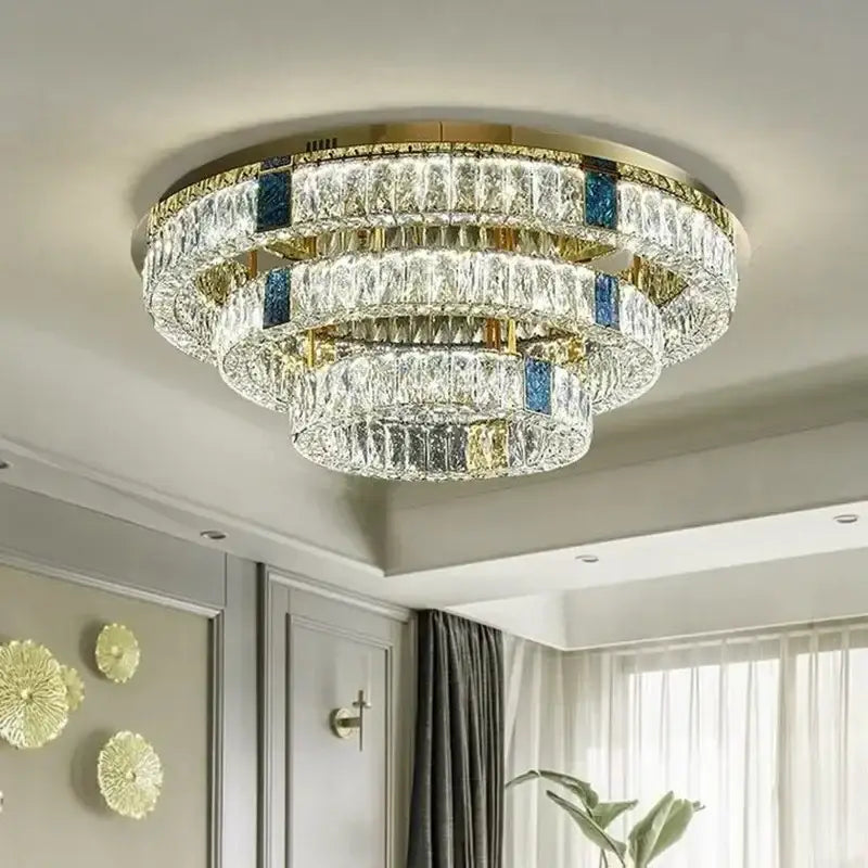 Modern gold two tier crystal led ceiling lamp with blue inlay details and gold-toned metal accents for living room