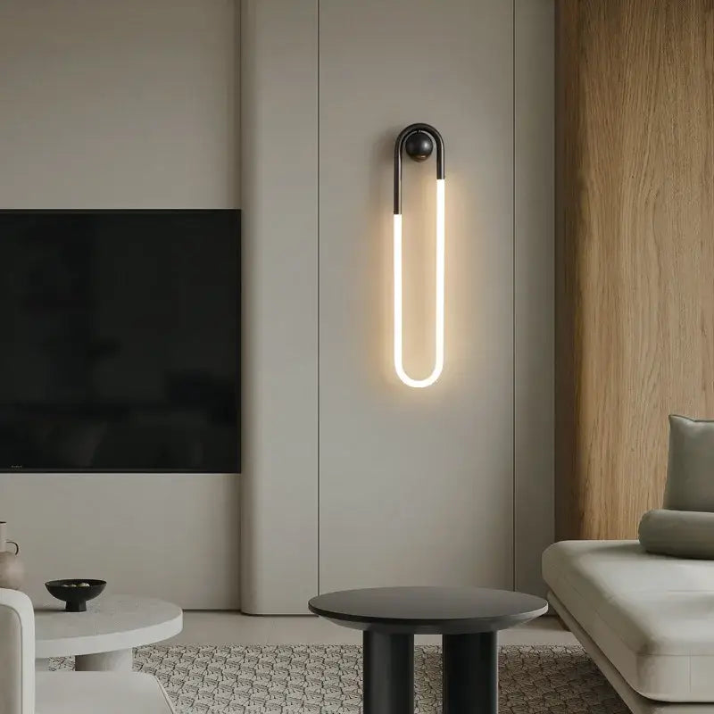 Modern black metal wall lights with glowing u-shaped led light fixture for bedroom decorbites ellipse wall lights