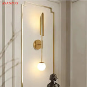 Modern gold vertical led wall lamps feature a sleek elongated design with a frosted glass bulb for living room wall lamps lights
