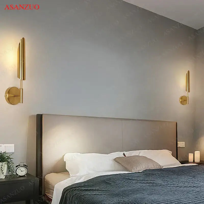 Modern gold vertical led wall lamps featuring sleek gold-toned bars and circular bases ideal for living room wall lamps lights