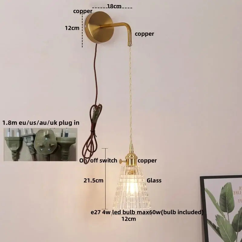 Modern gold wall lamp with gold toned copper and decorbites clear glass shade featuring geometric lattice design