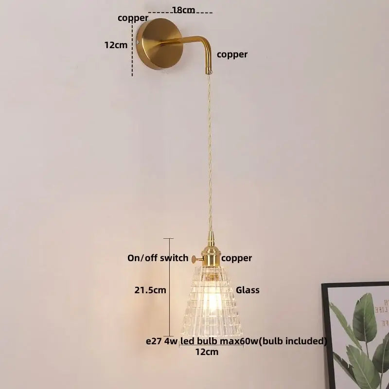 Modern gold wall lamp with brass-finished copper body and clear glass shade featuring a pull chain led bulb decorbites clear glass