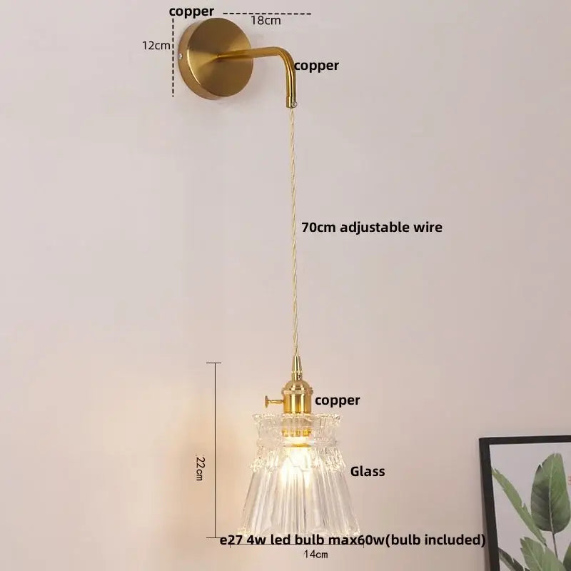 Modern gold wall lamp with clear glass shade and delicate copper sconce featuring decorbites clear glass and adjustable wire