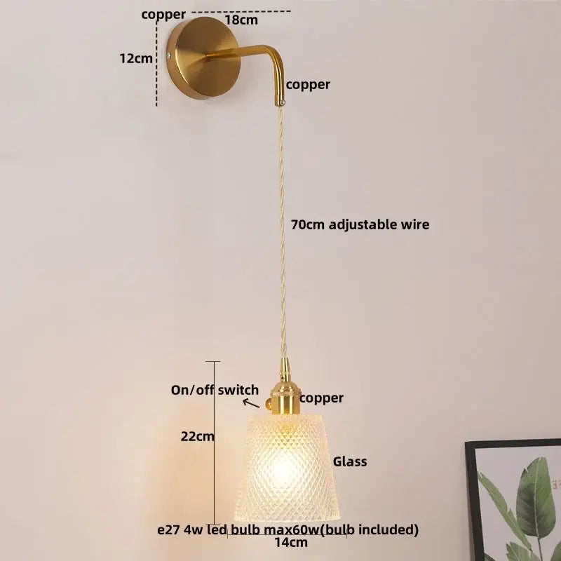 Modern gold wall lamp with brass-finished copper and decorbites clear glass shade featuring a 70cm adjustable wire