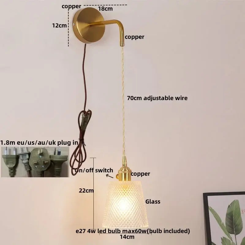 Modern gold wall lamp with brass-finished copper body, clear glass shade, and adjustable 70cm wire for decorbites clear glass use