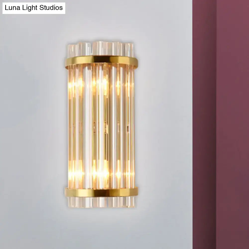 Modern gold wall lamp with crystal rod shade featuring vertical clear glass tubes for bedroom use