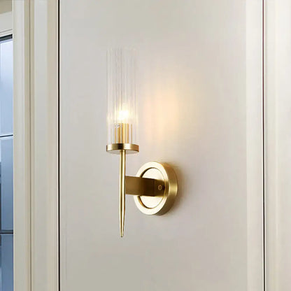 Modern gold wall sconce with clear vertically ribbed glass shade featuring led light for 110v-120v or 220v-240v use