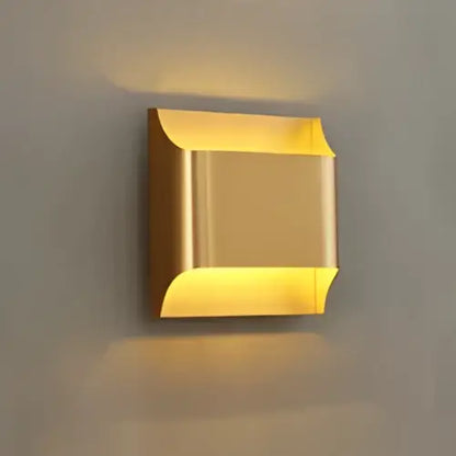 Modern gold wall sconce with a sleek rectangular design made of copper brass for minimalist living room wall lamp decorbites