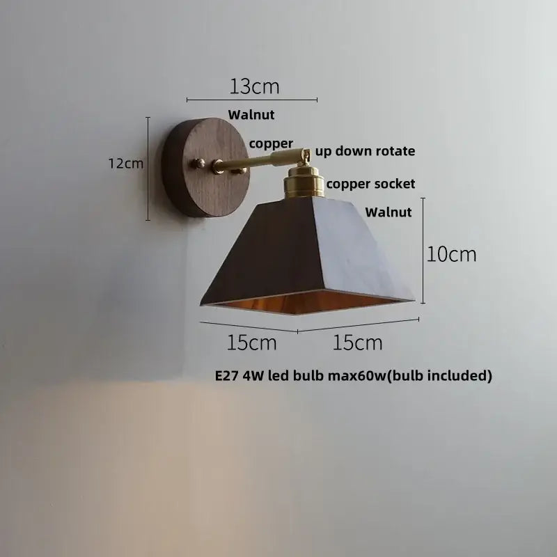 Modern gold walnut wall sconce with pull chain switch featuring a walnut base, copper arm, and black gold-lined shade