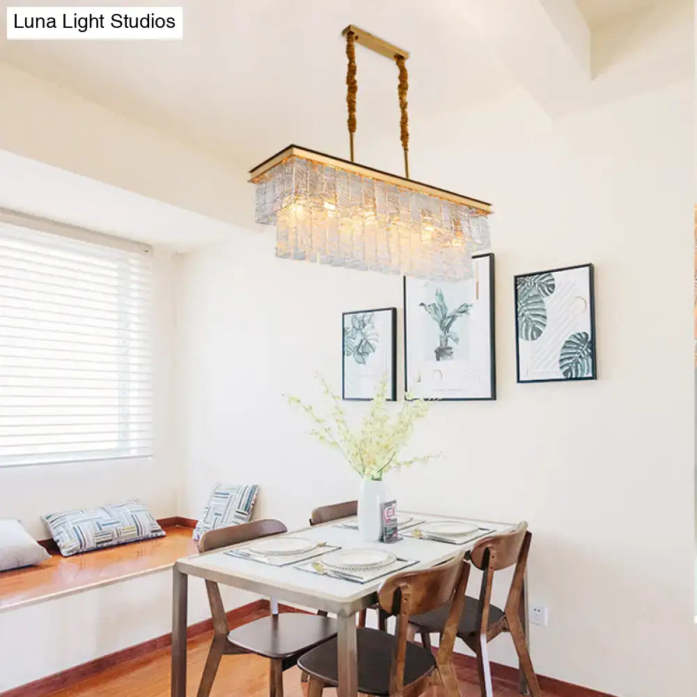 Modern gold water crystal pendant light with a rectangular frame and glass panels for dining room ceiling light