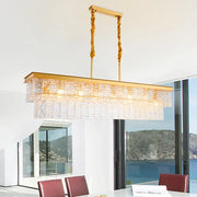 Modern gold water crystal pendant light with textured crystal panels and twisted brass chains for ceiling light use