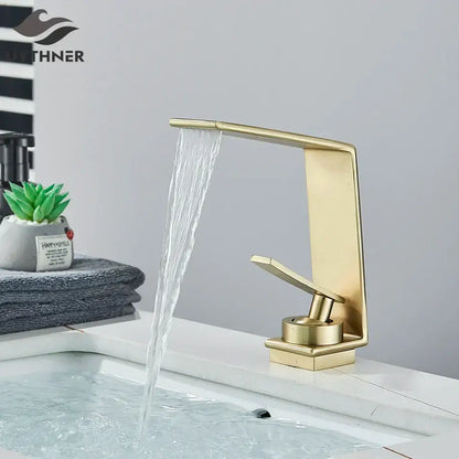 Modern gold waterfall basin faucet with brushed metal finish and sleek design from decorbites basin faucet collection