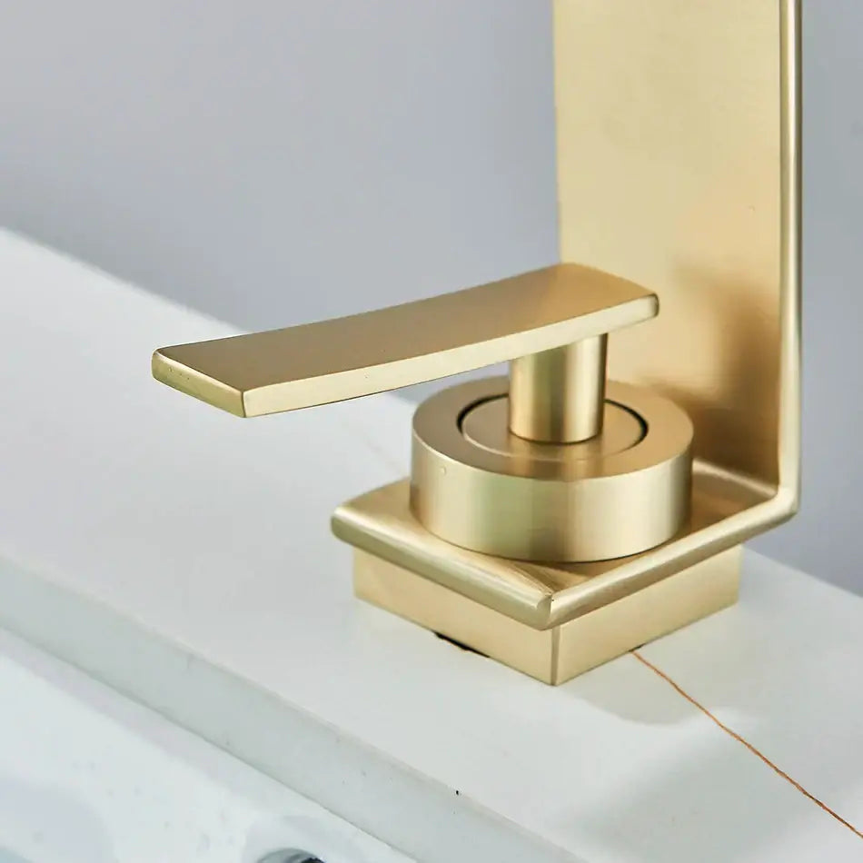 Modern gold waterfall basin faucet with sleek minimalist design and brushed metal finish by decorbites basin faucet