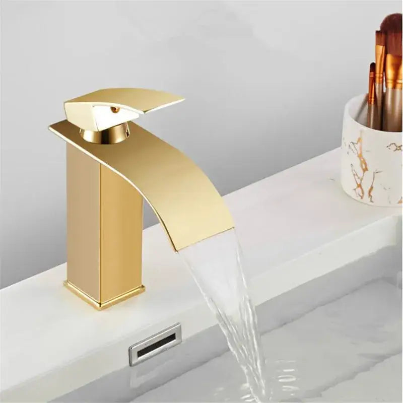 Modern gold waterfall basin faucet with polished metallic finish and sleek rectangular design for bathroom decorbites gold waterfall tap