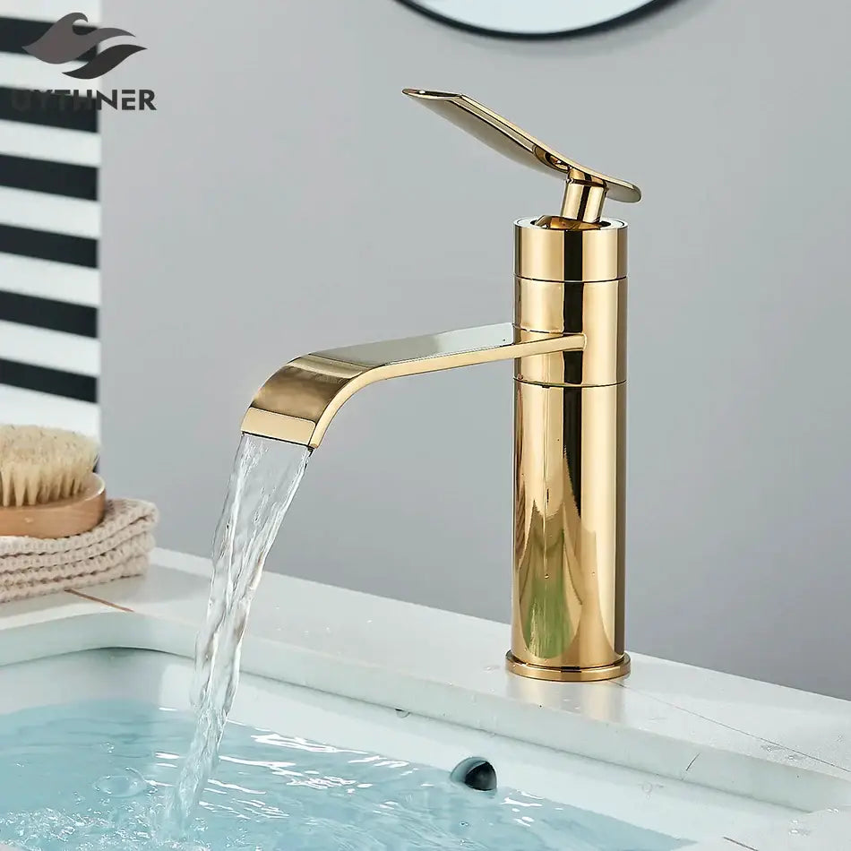 Modern gold waterfall basin faucet with sleek metallic finish and curved spout for decorbites basin faucet use