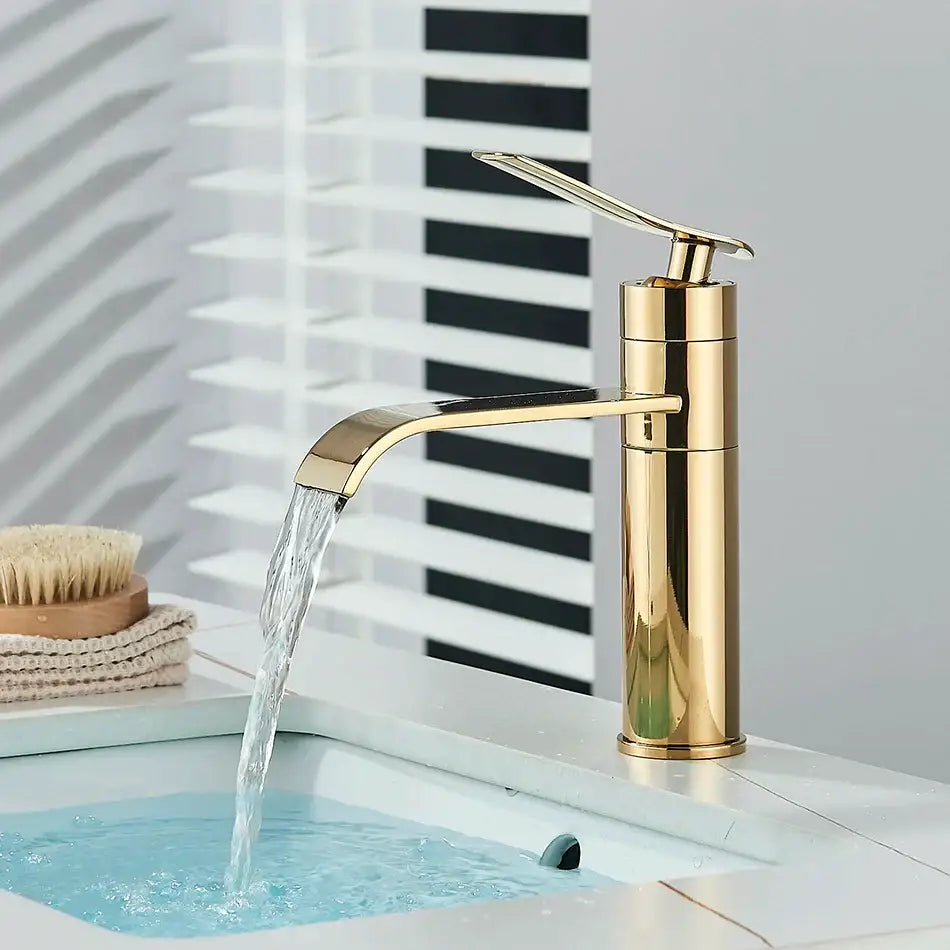 Modern gold waterfall basin faucet by decorbites with sleek curved spout and minimalist design for bathroom use
