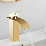 Modern gold waterfall basin faucet with brushed metal finish and sleek design by decorbites for bathroom use