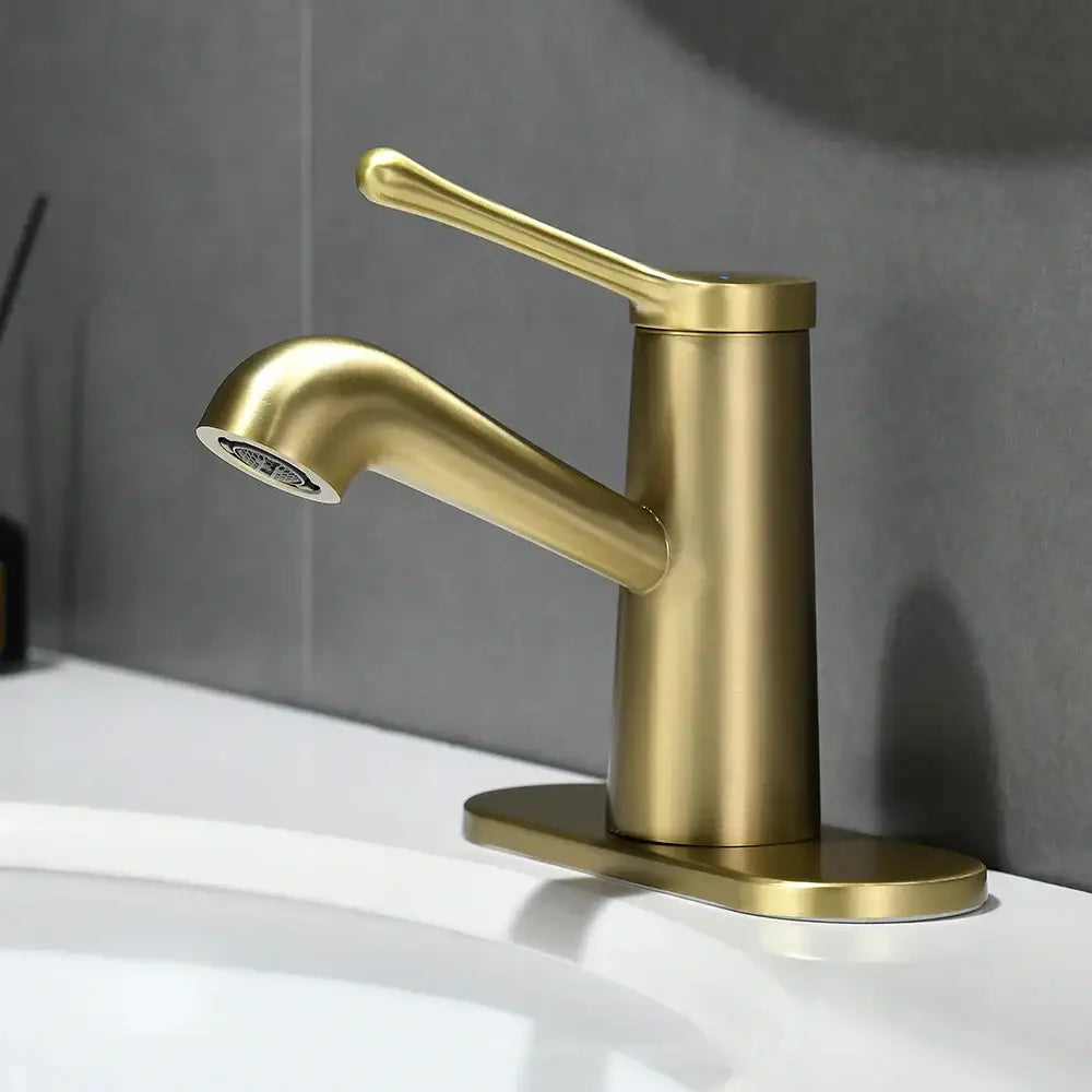 A sleek brushed gold waterfall basin faucet with a single handle and modern cylindrical base by decorbites gold waterfall