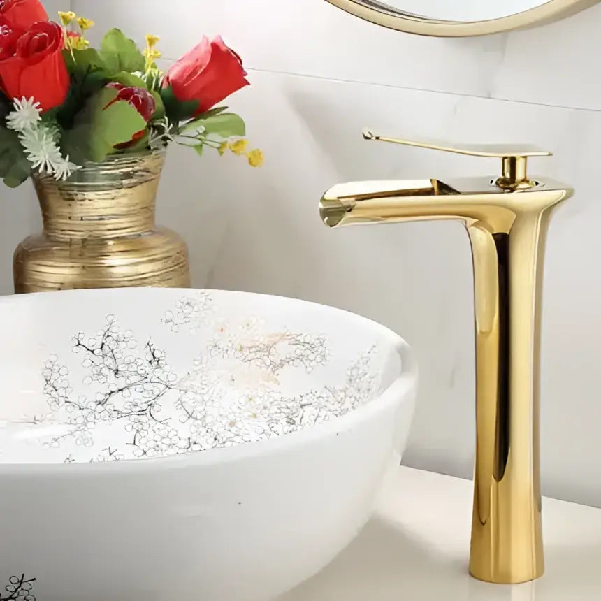 Modern gold waterfall basin faucet with sleek cylindrical spout and minimalist single lever design by decorbites gold