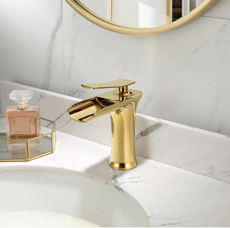 Modern gold basin faucet by decorbites with single handle and sleek waterfall spout for bathroom use