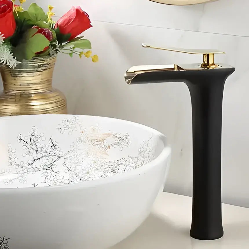 Modern gold waterfall basin faucet with black matte finish and gold decorbites gold accents for bathroom use