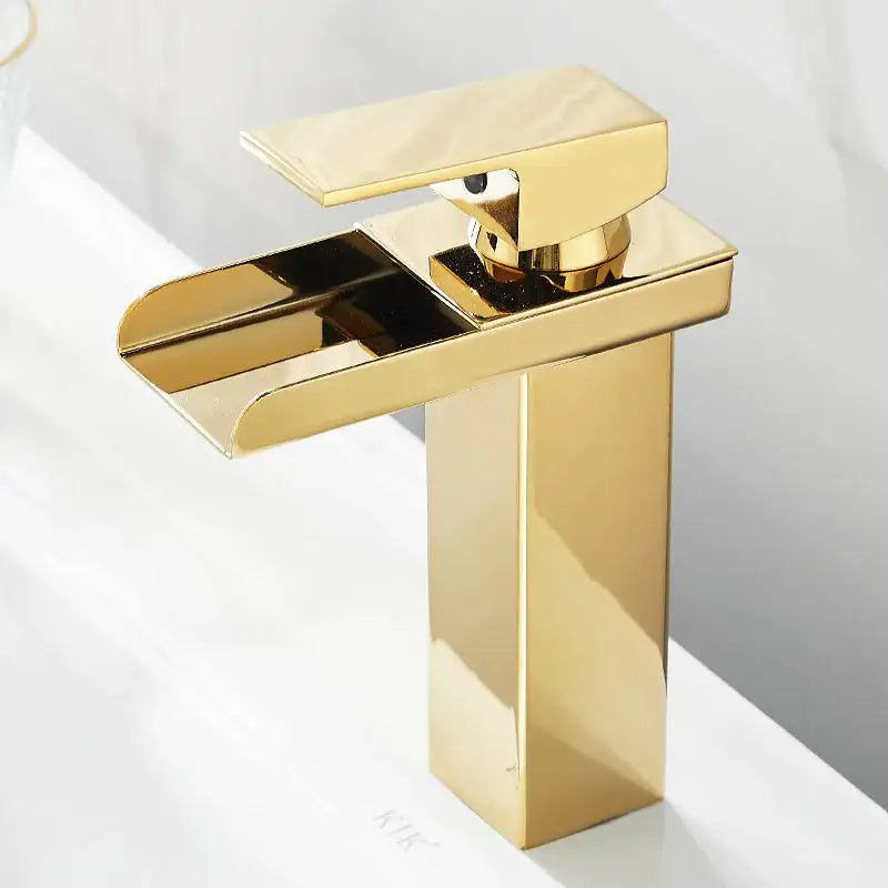 Modern gold waterfall basin faucet with sleek waterfall spout and polished metallic finish by decorbites gold waterfall
