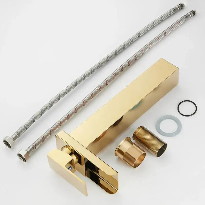 Modern gold waterfall basin faucet with gold finish, matching handle, and braided metal supply lines by decorbites gold waterfall