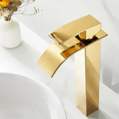 Modern gold waterfall basin faucet with a sleek rectangular spout and tall cylindrical base for bathroom decorbites gold waterfall