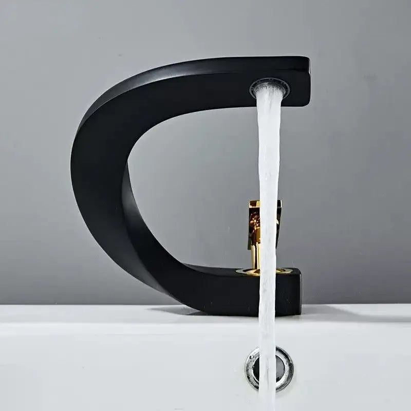 Modern gold waterfall brass basin faucet with black matte finish and gold-toned handle for bathroom decorbites brass basin