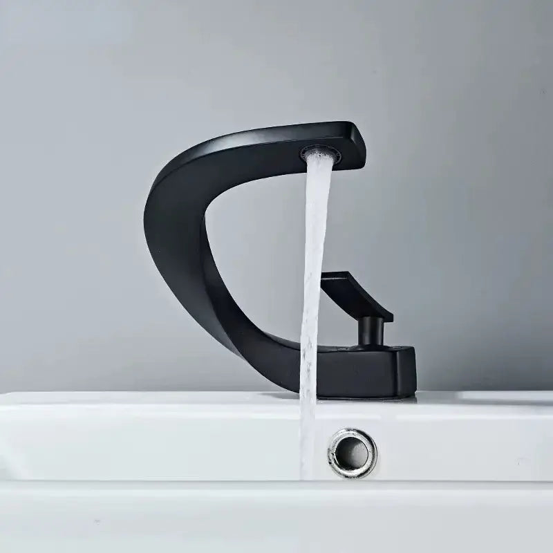 Modern gold waterfall brass basin faucet with black matte finish and sleek curved design decorbites brass basin faucet