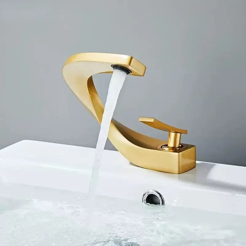 Modern gold waterfall brass basin faucet with sleek curved design and brushed metal finish for bathroom sink decorbites brass basin faucet