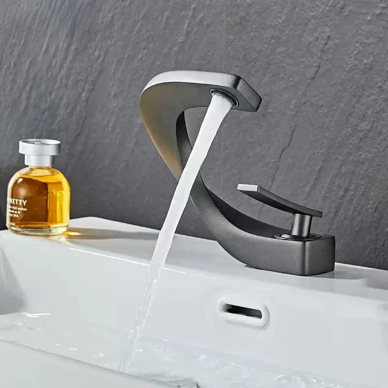 Modern matte black basin faucet with sleek curved design and polished chrome accents for bathroom decorbites brass basin