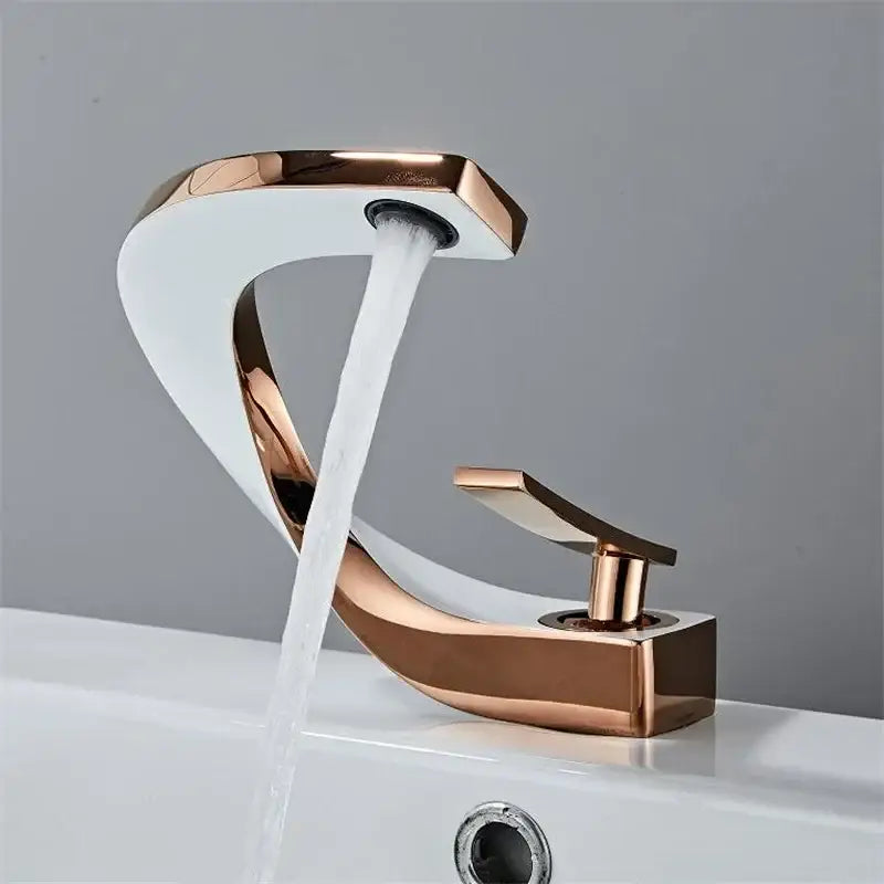 Modern gold waterfall mixer bathroom faucet in rose gold with sleek curved design and flowing water stream