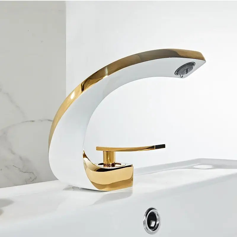 Modern gold waterfall mixer bathroom faucet with sleek curved design in gold and white ceramic material